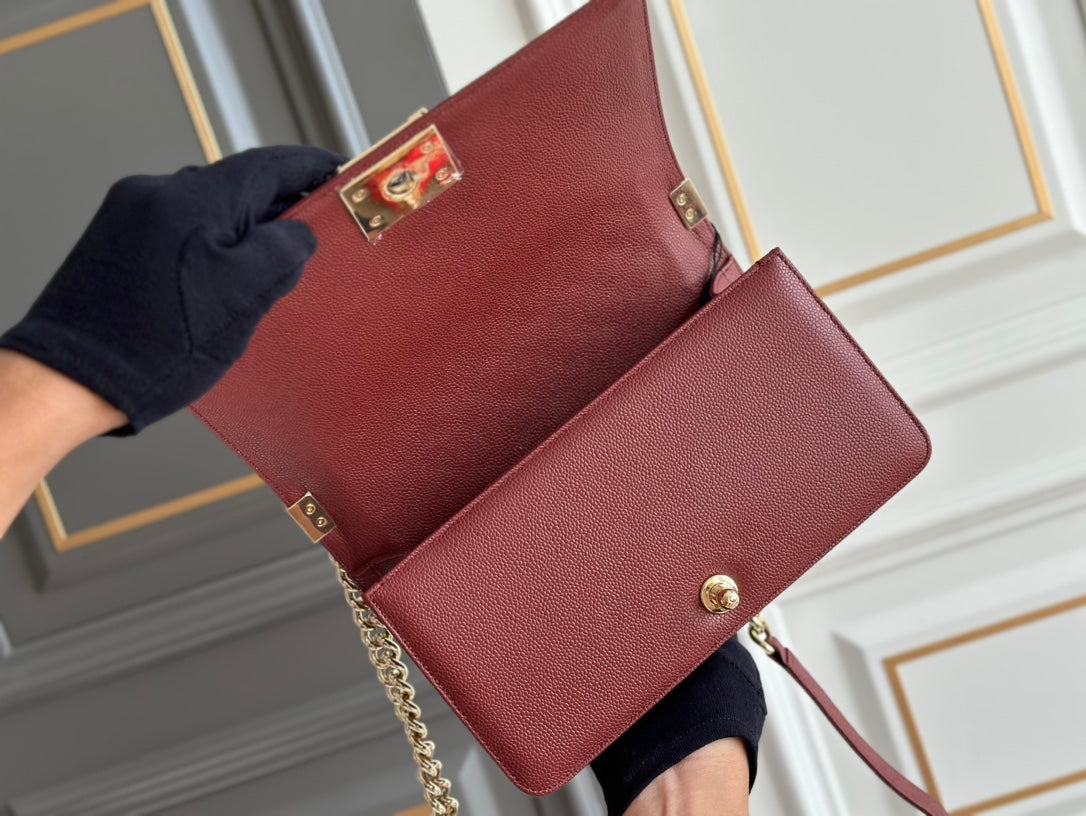 CHANEL boy medium 25 wine quilted caviar ghw